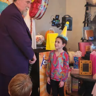 Great Scot having the birthday girl help him with his tricks.