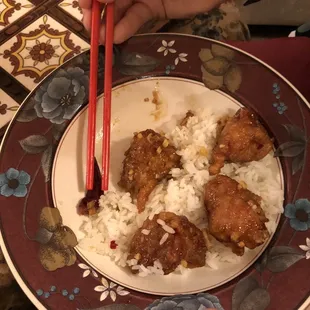 a plate of rice and meatballs