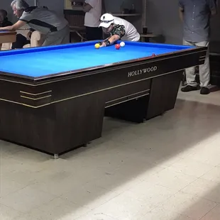a pool table in a bar