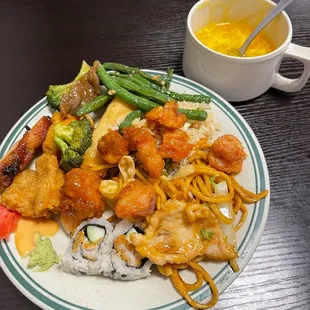 a plate of food and a cup of soup