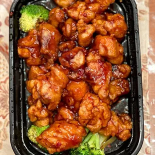 a tray of chicken and broccoli