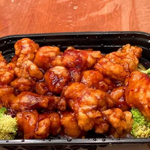 a tray of chicken and broccoli