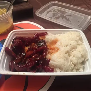 a plate of rice and meat