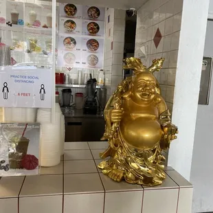 a statue of a laughing buddha