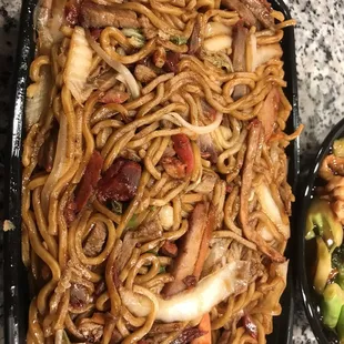 a plate of noodles and vegetables