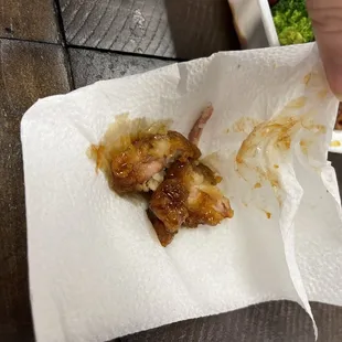 a person holding a piece of food