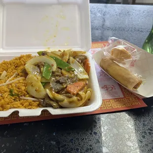 Beef in curry sauce, fried rice, and an egg roll