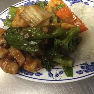 a plate of food with rice and vegetables