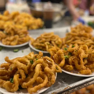 a tray of deep fried onion rings