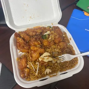 a take out container of chinese food