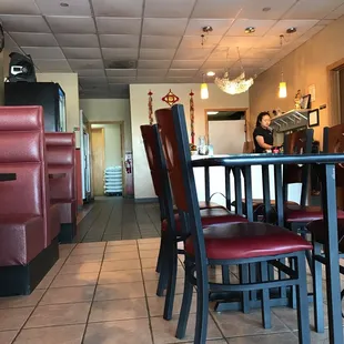 a dining area with a table and chairs