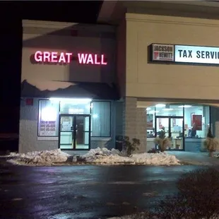 the outside of a building at night