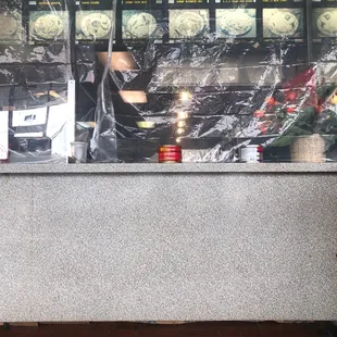 Buckets of water keep the plastic sheet in place.