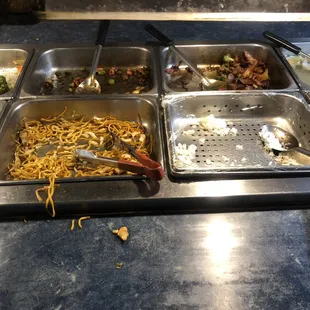 a variety of food items in a buffet