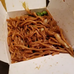 a take out box of noodles