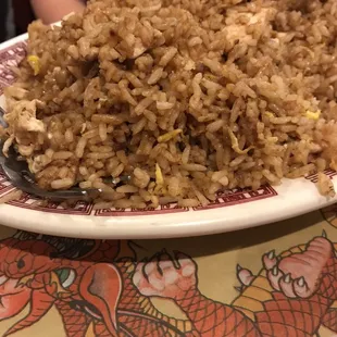 a plate of fried rice on a table