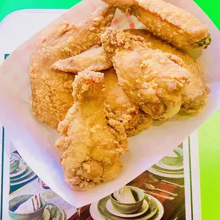 a plate of fried chicken on a table