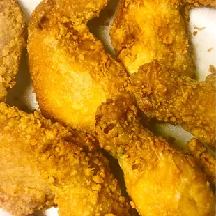 a plate of fried chicken wings