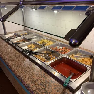 a buffet with a variety of food items