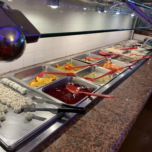 a buffet with a variety of food items