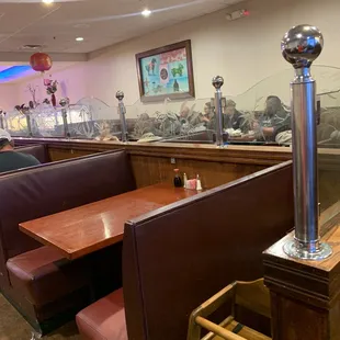 a restaurant with booths and tables