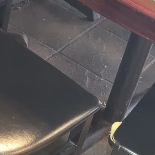 Food and dust under tables