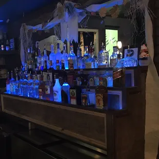 a bar with bottles of alcohol