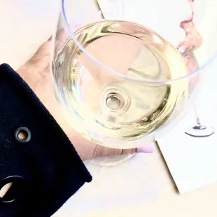 Glass of iL Monte and my grommet holes ALO yoga wear