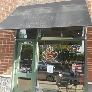 a bicycle parked in front of a restaurant