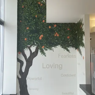a mural of an orange tree
