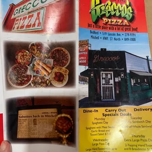 a hand holding a menu