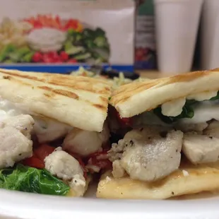 Apollo- Marinated Chicken breast, Spinach , Tomato, Feta topped with Tzadziki