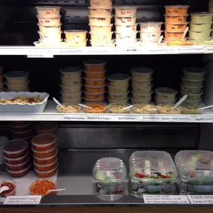 Fresh made dips and spreads for sampling along with Greek salads ready to go or to eat here.