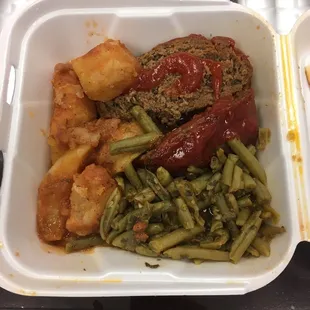 a meal in a styrofoam container