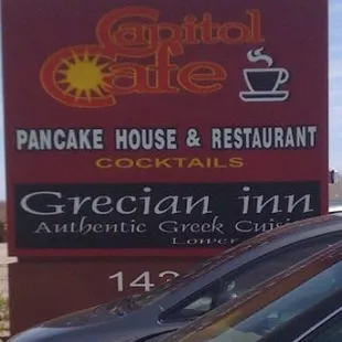 a car parked in front of a sign