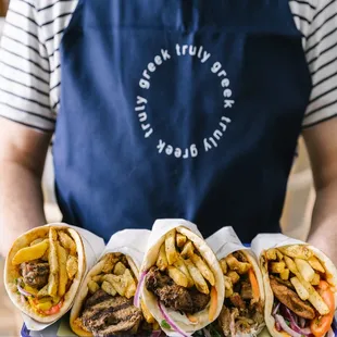 a man holding a tray of food