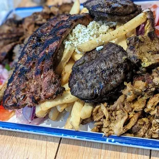 a plate of meat and french fries