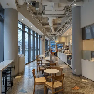 a view of a cafeteria with tables and chairs