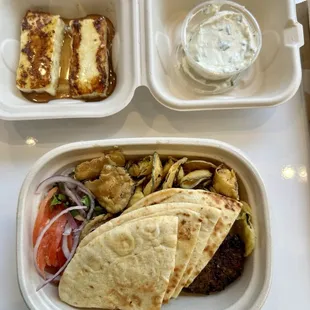 Vegetarian plate, lemon yogurt sauce on the side, and side of grilled halloumi