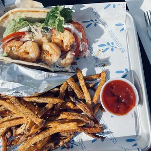 Grilled shrimp pita with lemon oregano hand-cut fries.