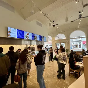 a group of people standing in a store