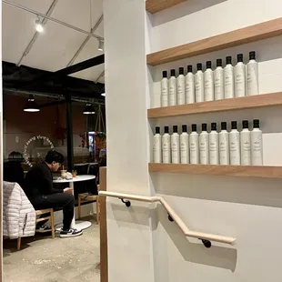 a man sitting at a table in a salon