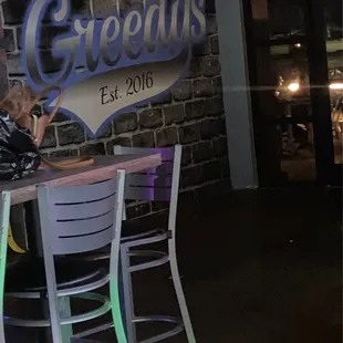 a woman sitting at a bar