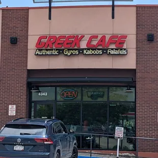 a car parked in front of the restaurant