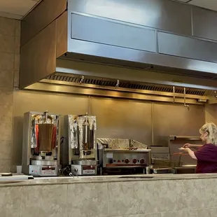 a woman preparing food in the kitchen