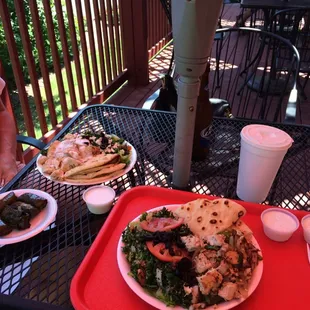 Chicken chef salad, chicken Greek salad and grape leaves