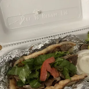 Gyro with the special I WON'T ATTEMPT to spell it sauce it was decent and full of meat.