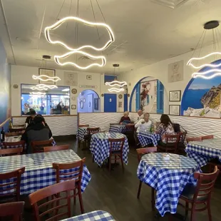 Inside dining room. Love the blue checkered table cloths.