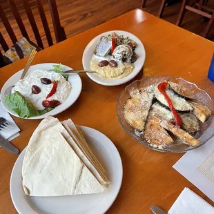 plates of food on a wooden table