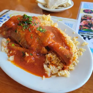 Lamb in red sauce. I can&apos;t believe this only costs $16 and change. Meat falls off the bone, incredible.